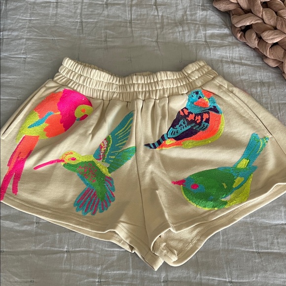 QUEEN OF SPARKLES Cream Shorts with Colorful Bird Design